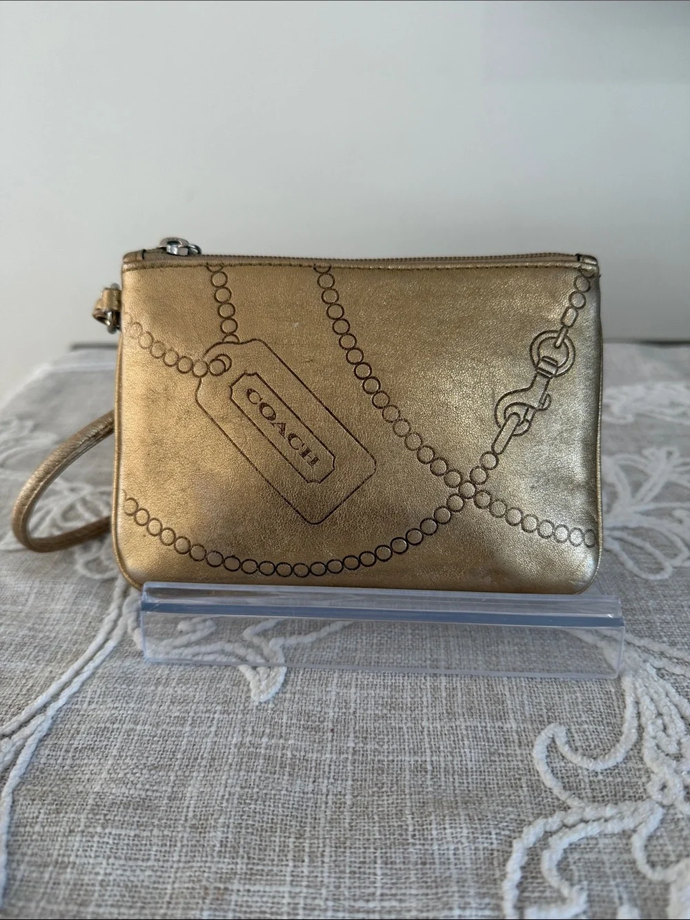 Coach Metallic Gold Wristlet with Embossed Chain Motif
